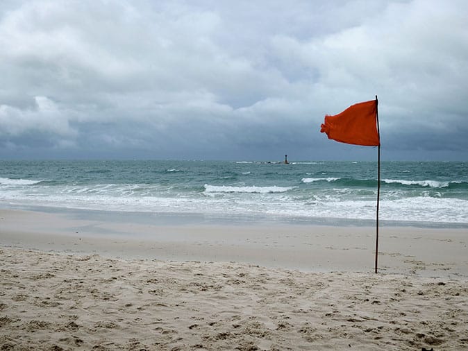 red flags at beach issue a warning 
